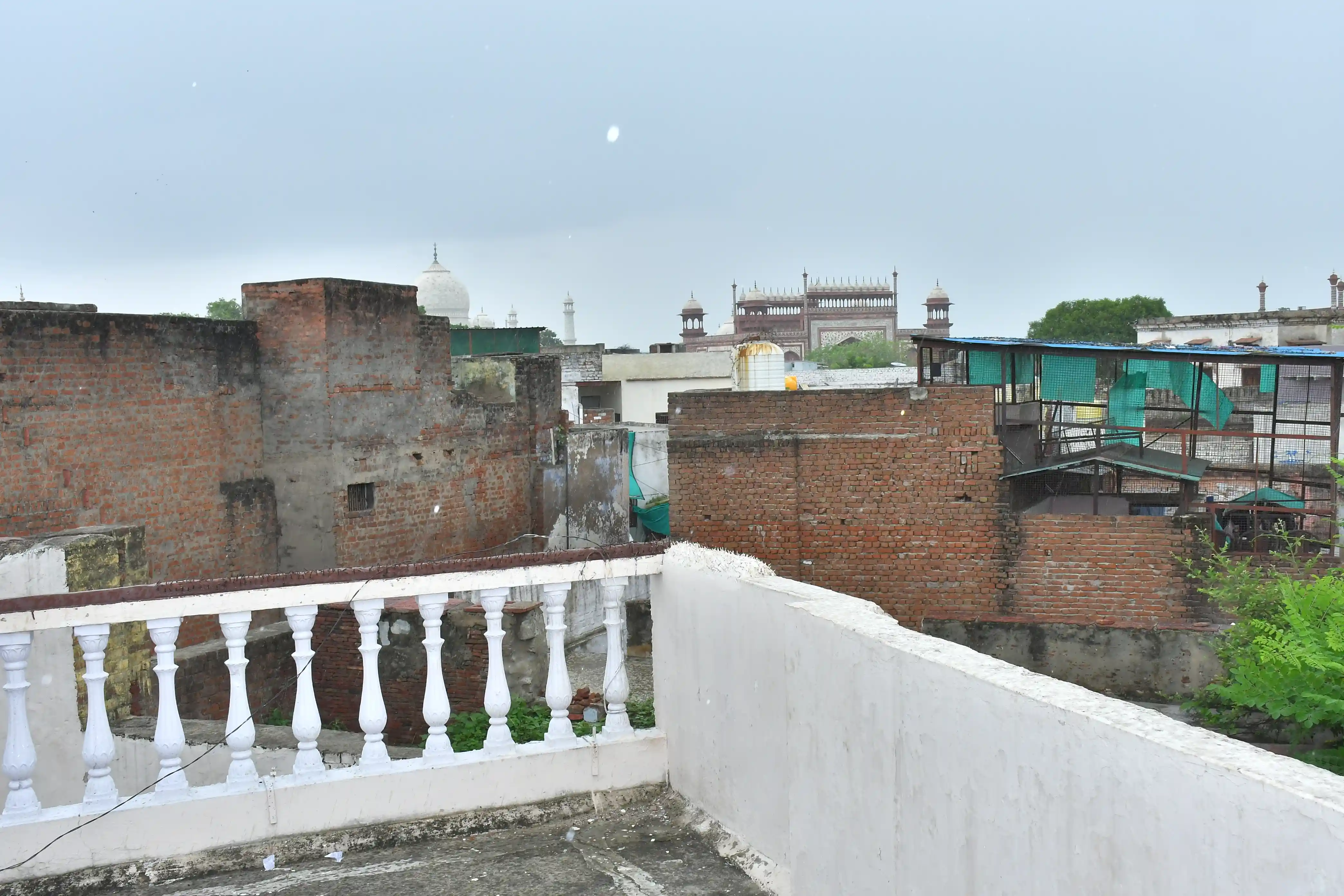 Hotel Sidhartha terrace at sunrise with Taj Mahal in the distance